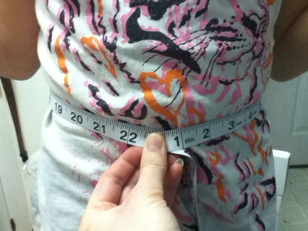 Measure where you want the tutu to sit. Subtract 2 inches for a smaller tutu, and 4 inches for a larger tutu. When you tie on the tulle, it will stretch and become larger.