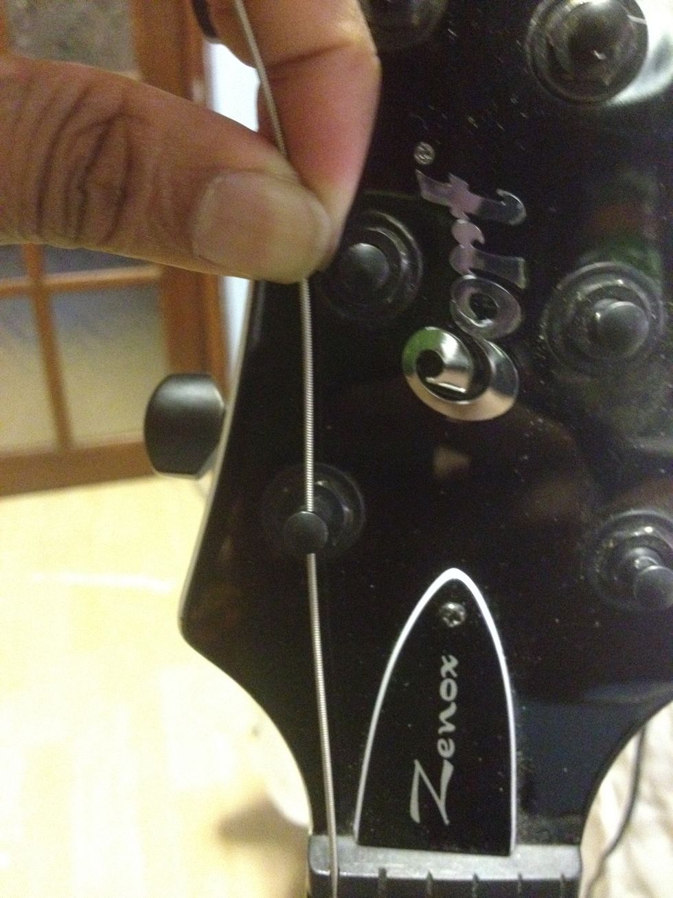 Measure with your fingers to the next nut (roughly 3cm)