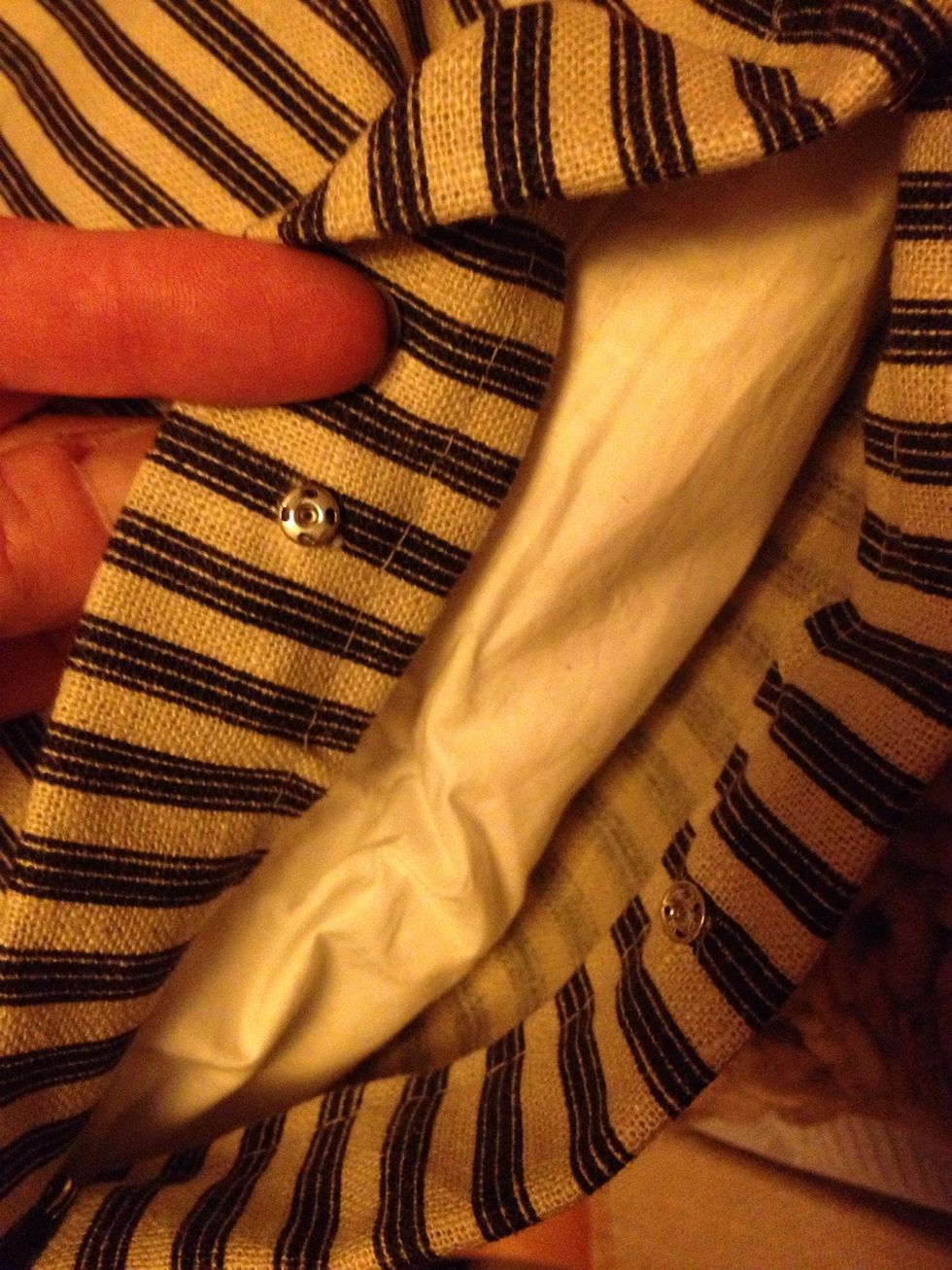 Measure your cushion and sew up a pillowcase (see my guide on how to do that) On this I used press studs. I sewed them on by hand.