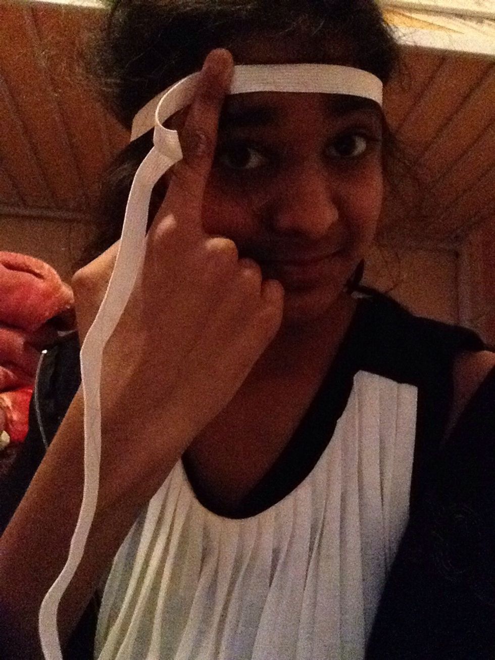 Measure your head with the elastic! Then hold your finger a bit further down on where the end touch the other elastic piece! Take the elastic off your head while holding that spot!