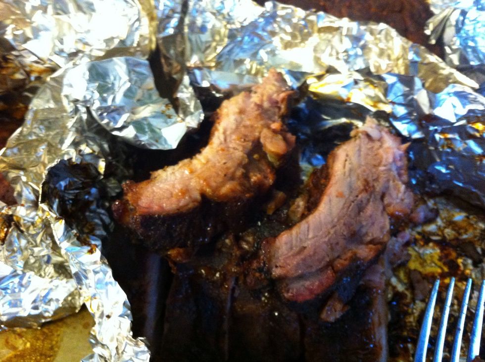 Meat pulls away from the bone.