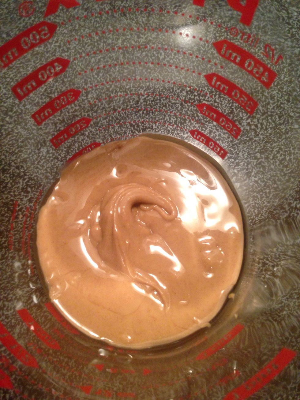 Melt 1/2 cup of raw organic peanut butter in the oven until soft and spreadable or in the microwave for 30-45 seconds.