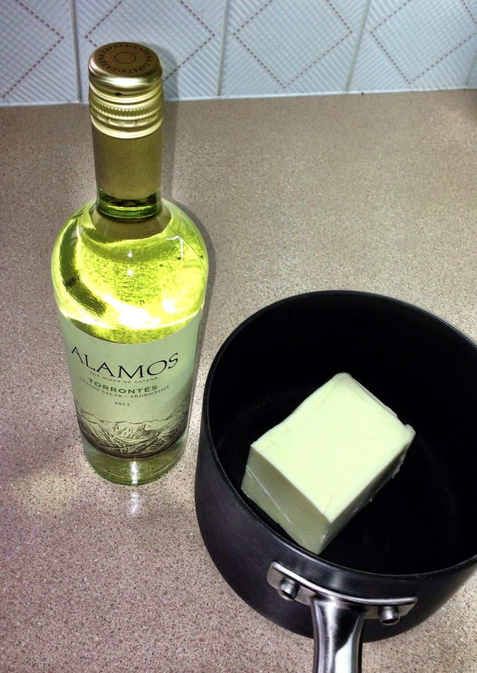 Melt 3/4 pound of unsalted butter with one bottle of white wine over very low heat.