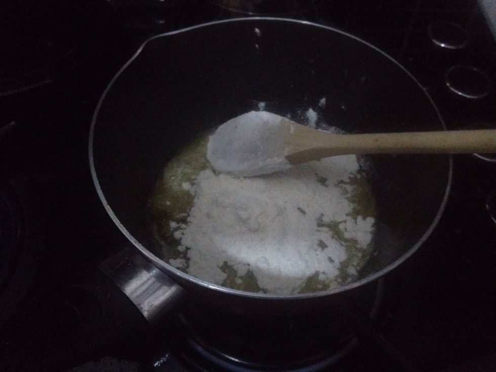 Melt 3 large spoons of butter in a pan. Next take off the heat and add two large spoons of plain flour and pepper