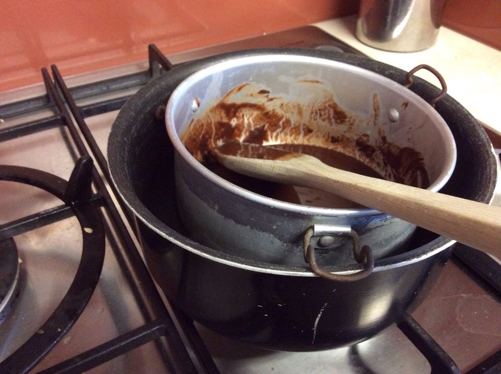 Melt 85g of butter and 55g of chocolate in a bowl set over a pan full of boiling water.