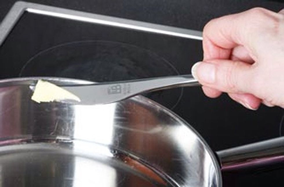 Melt a piece of hot butter into a frying pan
