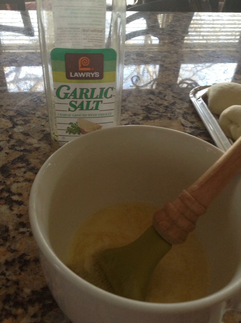 Melt about 2 TB butter. Use a brush to glaze the rolls with butter