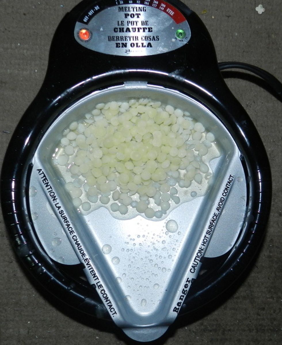 Melt beeswax.