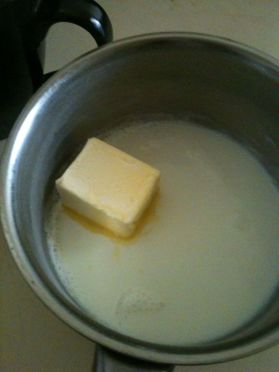 Melt butter, 1/2 cup of milk, sugar and salt in a small pan just when the milk starting to bubble around the side's, turn th heat off. Let it cool