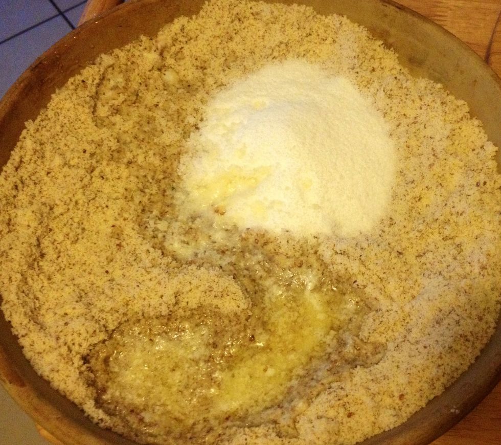 Melt butter. Add directly to almond meal and stevia in pie pan.