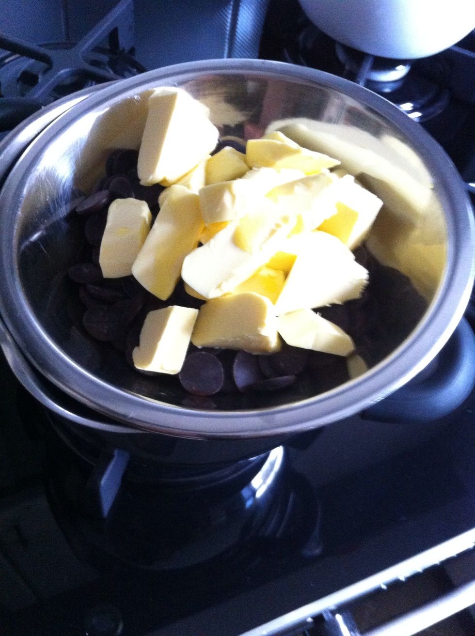 Melt butter and chocolate on a bain marie. (Check internet for "bain marie" if U do not know.)Remove from heat when 2/3 of chocolate is melted, keep stirring and let it melt completely.