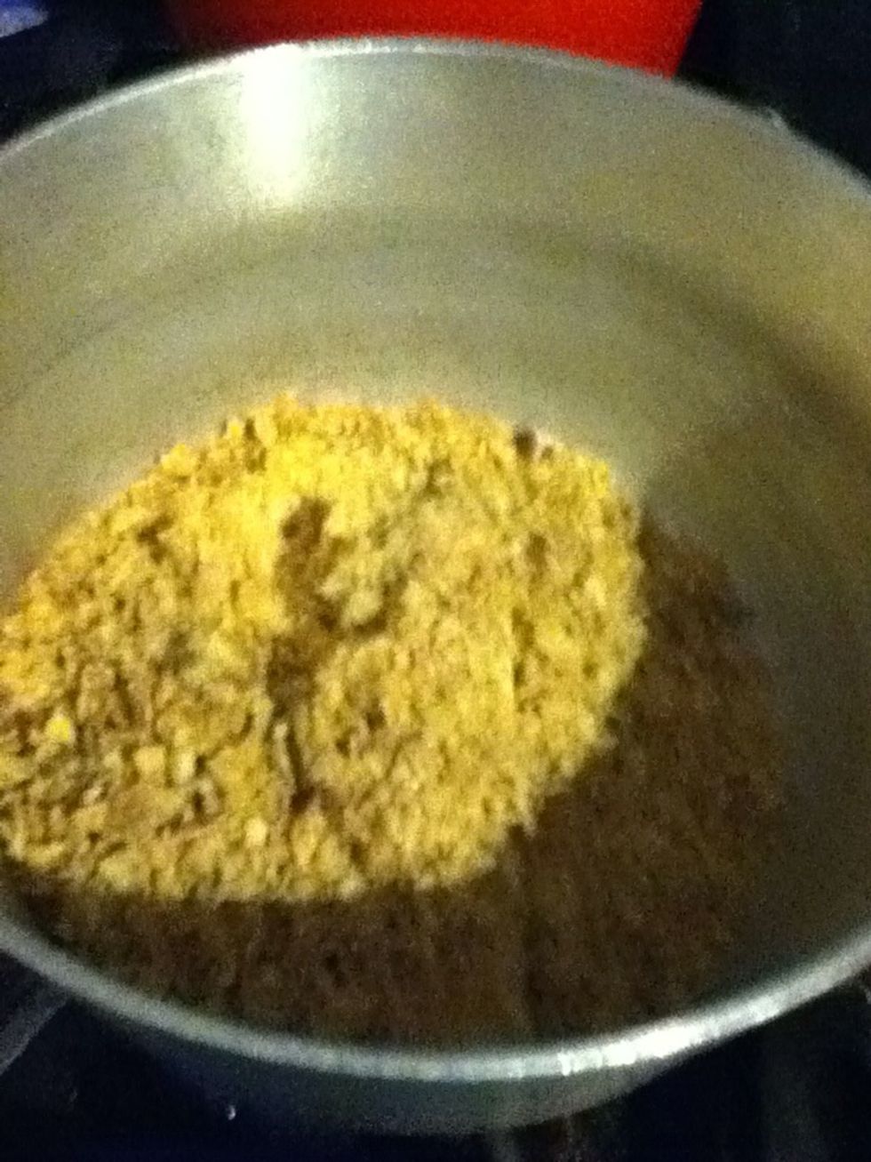 Melt butter and crumbs.. Continue holding the cupcake tins