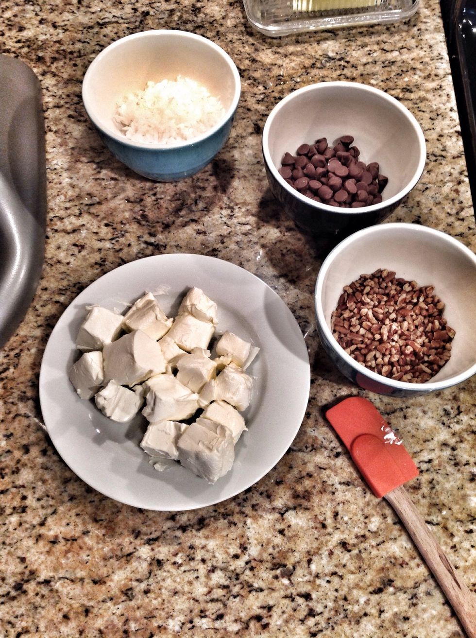 Melt butter for about 10 seconds in a small bowl or dish, then add the cubed cream cheese, melted butter (save a little for pastry brushing), and sugar to a bowl for mixing. Mix well until creamy.