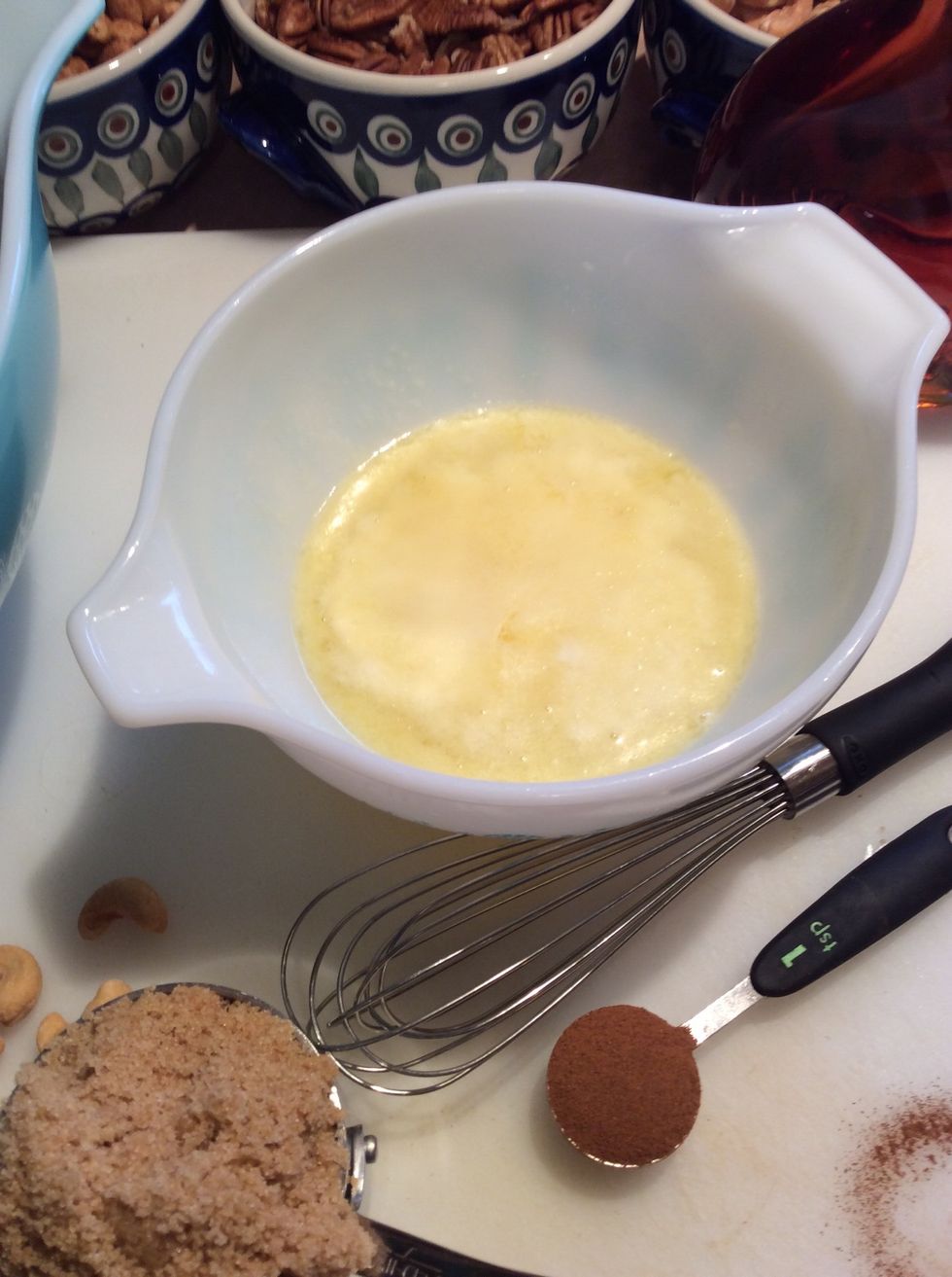 Melt butter in a glass bowl.