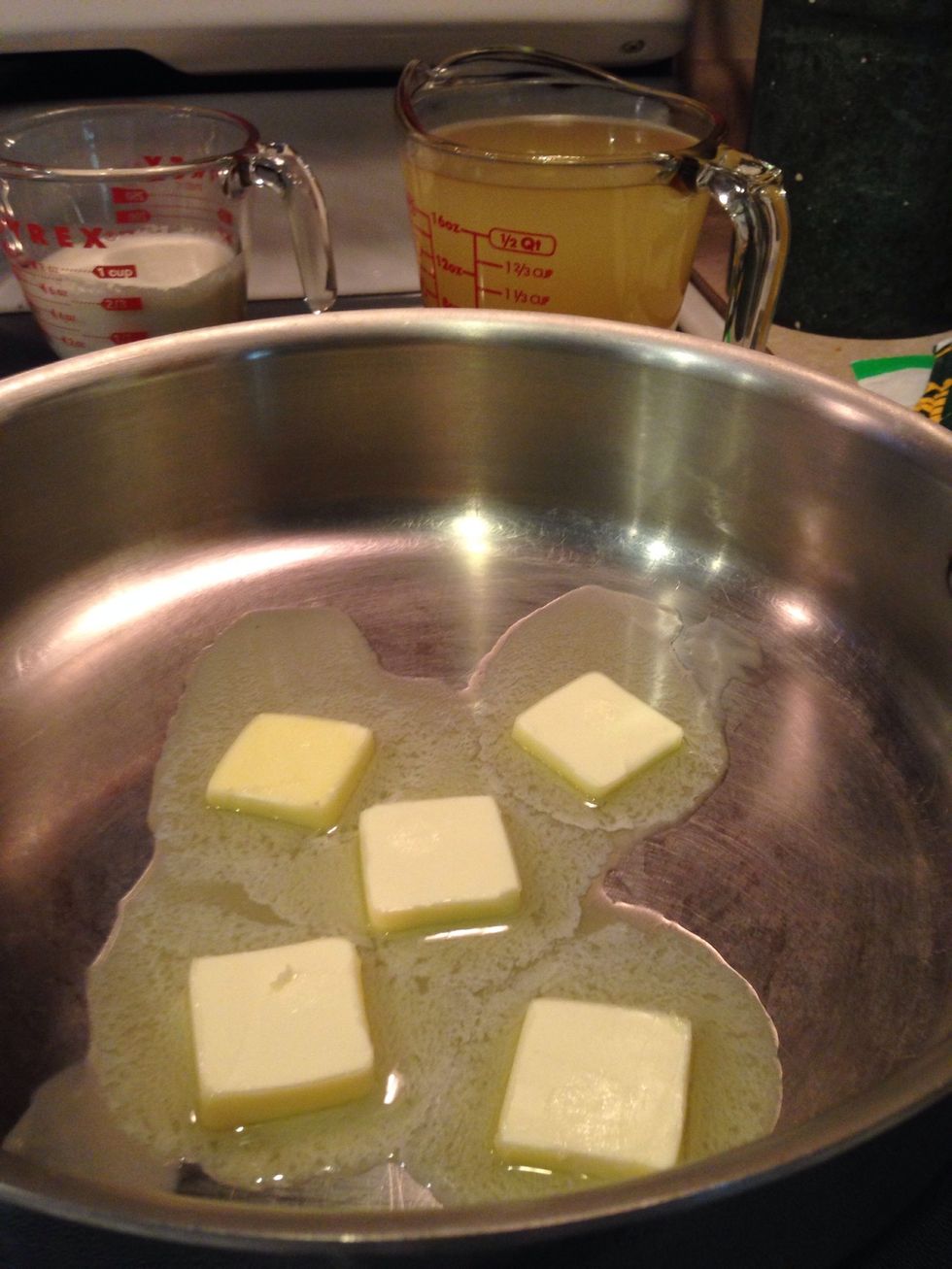 Melt butter in a large skillet or saut\u00e9 pan over medium heat.