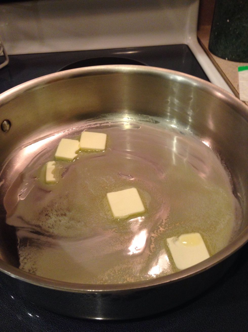 Melt butter in a large skillet over medium heat.
