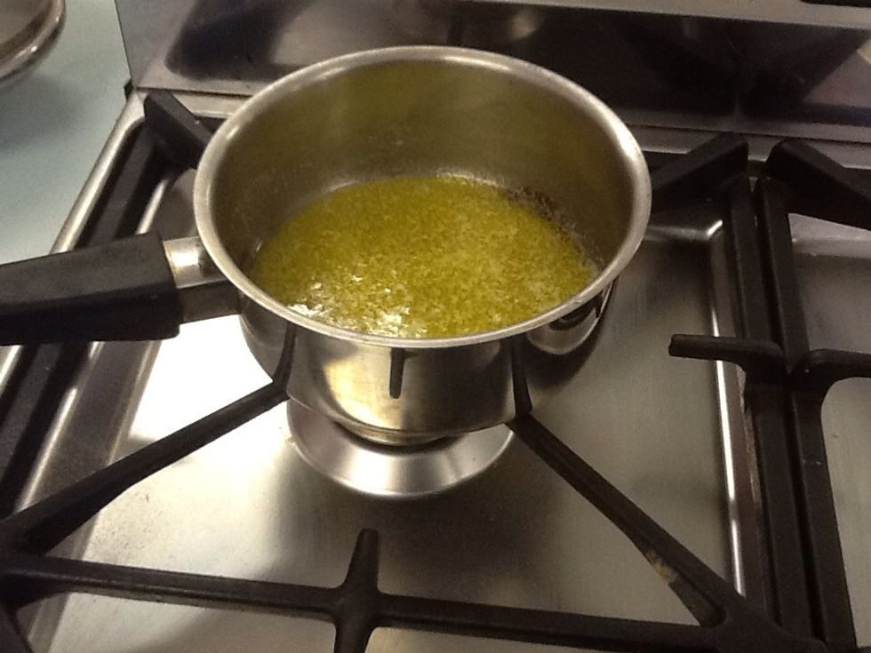 Melt butter in a pan until there's a little bit left