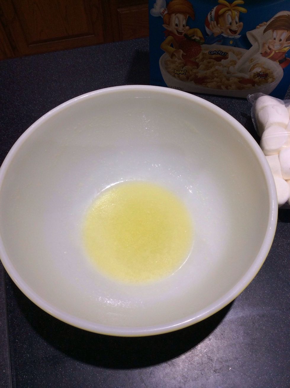 Melt butter in large bowl in microwave.