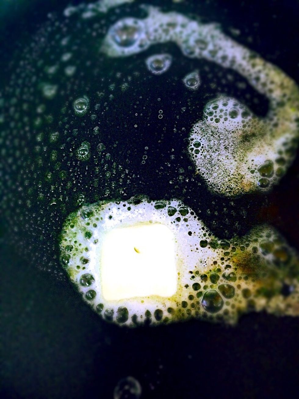 Melt butter in the frying pan on a medium/low heat. Be careful not to burn it. It will change the taste of a bread