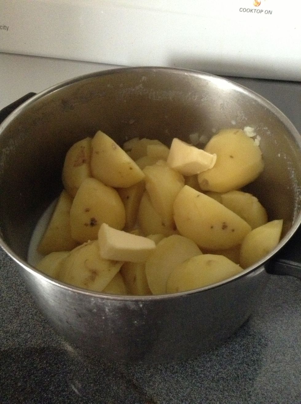 Melt butter on low on top of potatoes