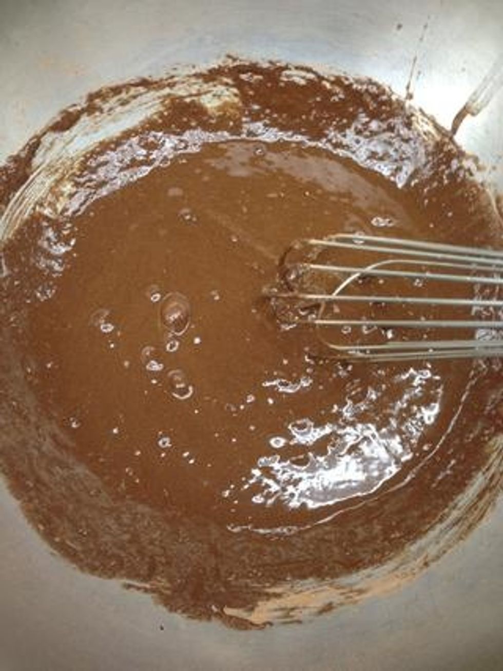 Melt chocolate and butter. Mix sugar and cocoa together in a separate large bowl. Add eggs, whisk until well blended. Whisk in chocolate mixture.