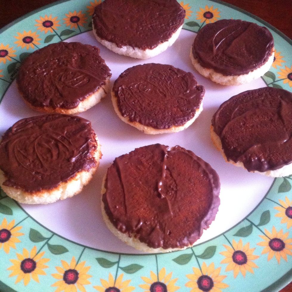 Melt chocolate in microwave, dip the bottom of each macaroon and refrigerate for 20-30 minutes.