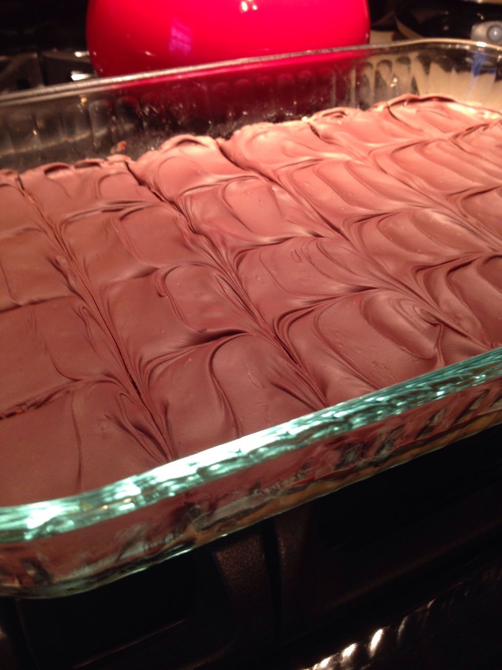 Melt chocolate, spread on chilled peanut butter base, and slice into squares!