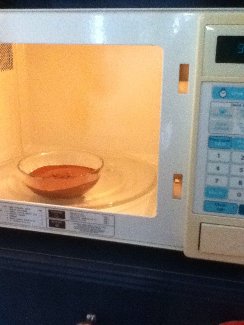 Melt in the microwave approximatively 40 seconds. You can add a little bit of milk if you want a more liquid Nutella.