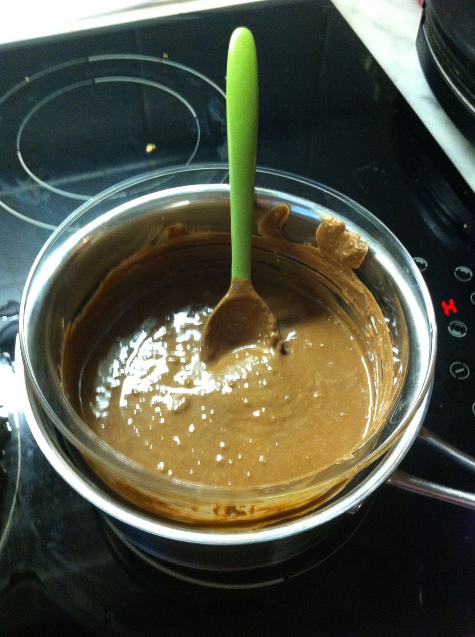 Melt it in a water heated bowl. I would not recommend using a microwave for this. Let it cool in the fridge for 10 minutes.