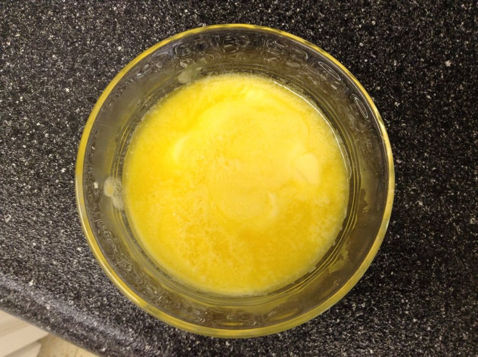 Melt it in the microwave (about 30 sec)