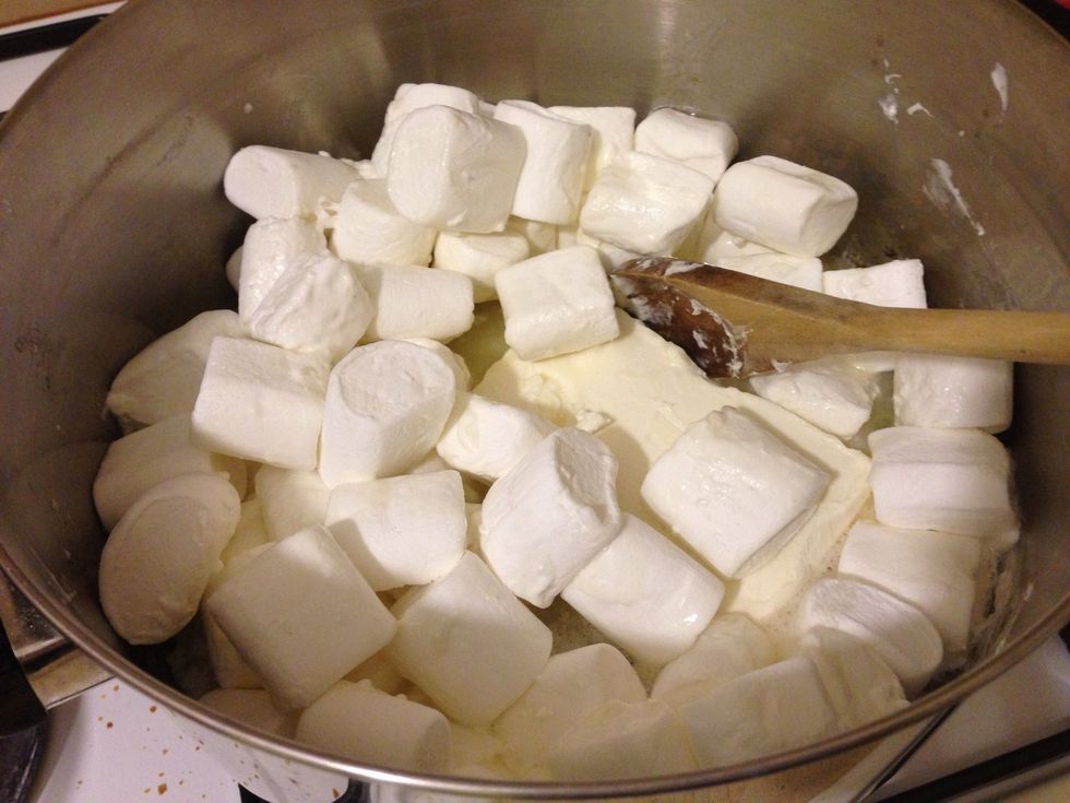 Melt marshmallows and margarine