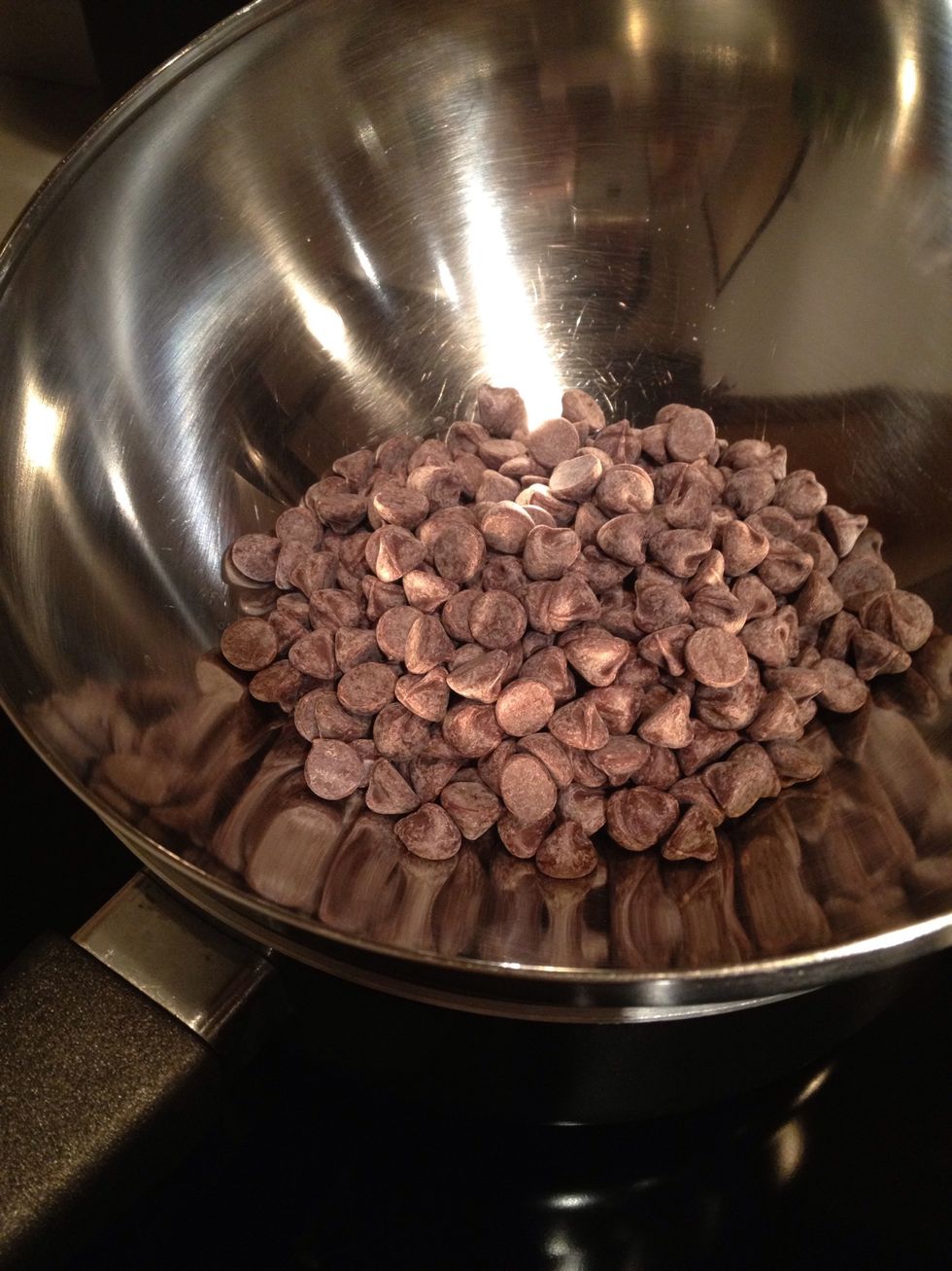 Melt semisweet chocolate on boiling water.