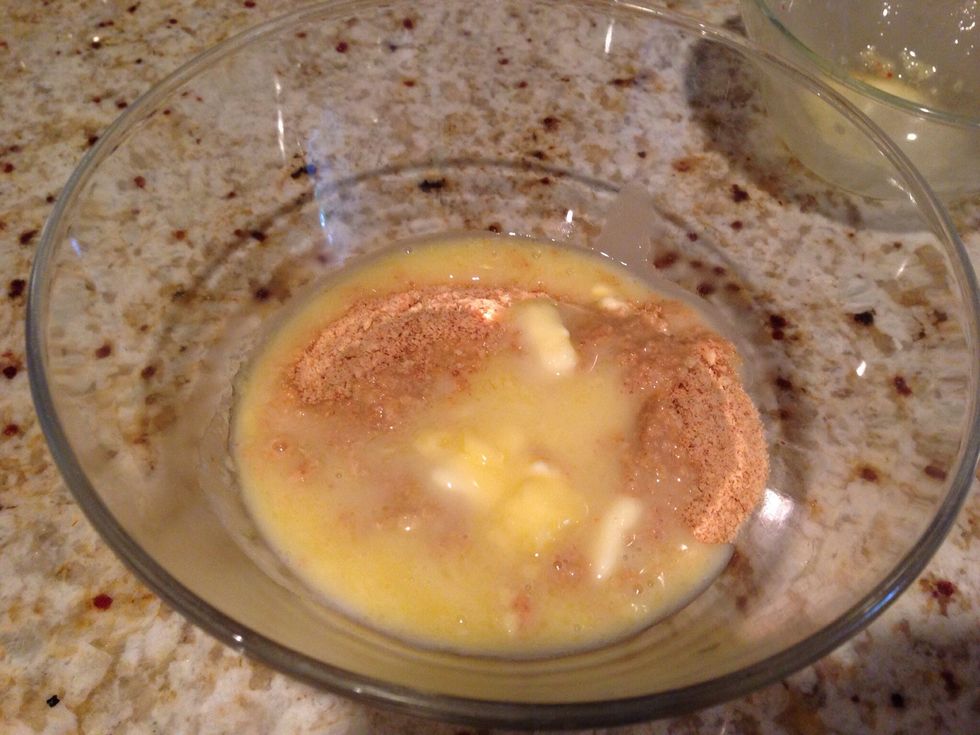 Melt stick of butter and mix into grahams with a fork.