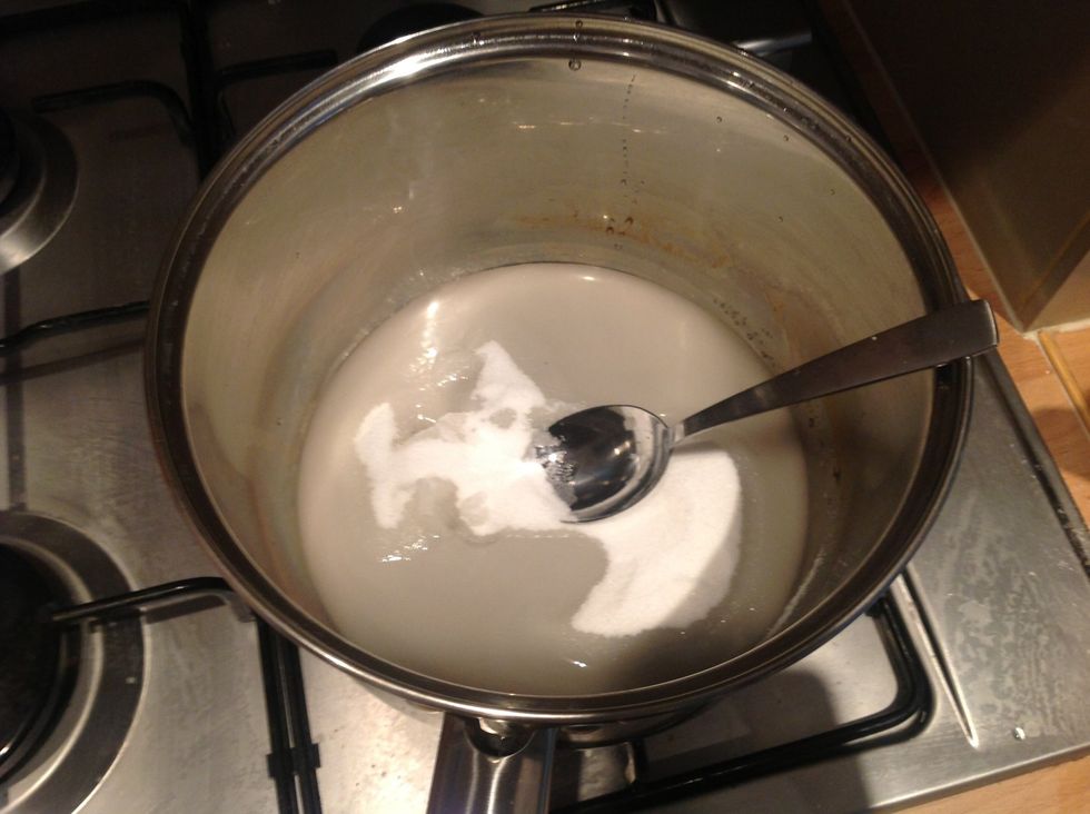 Melt the 100g sugar and the water in a pan on a medium heat until the sugar is all dissolved