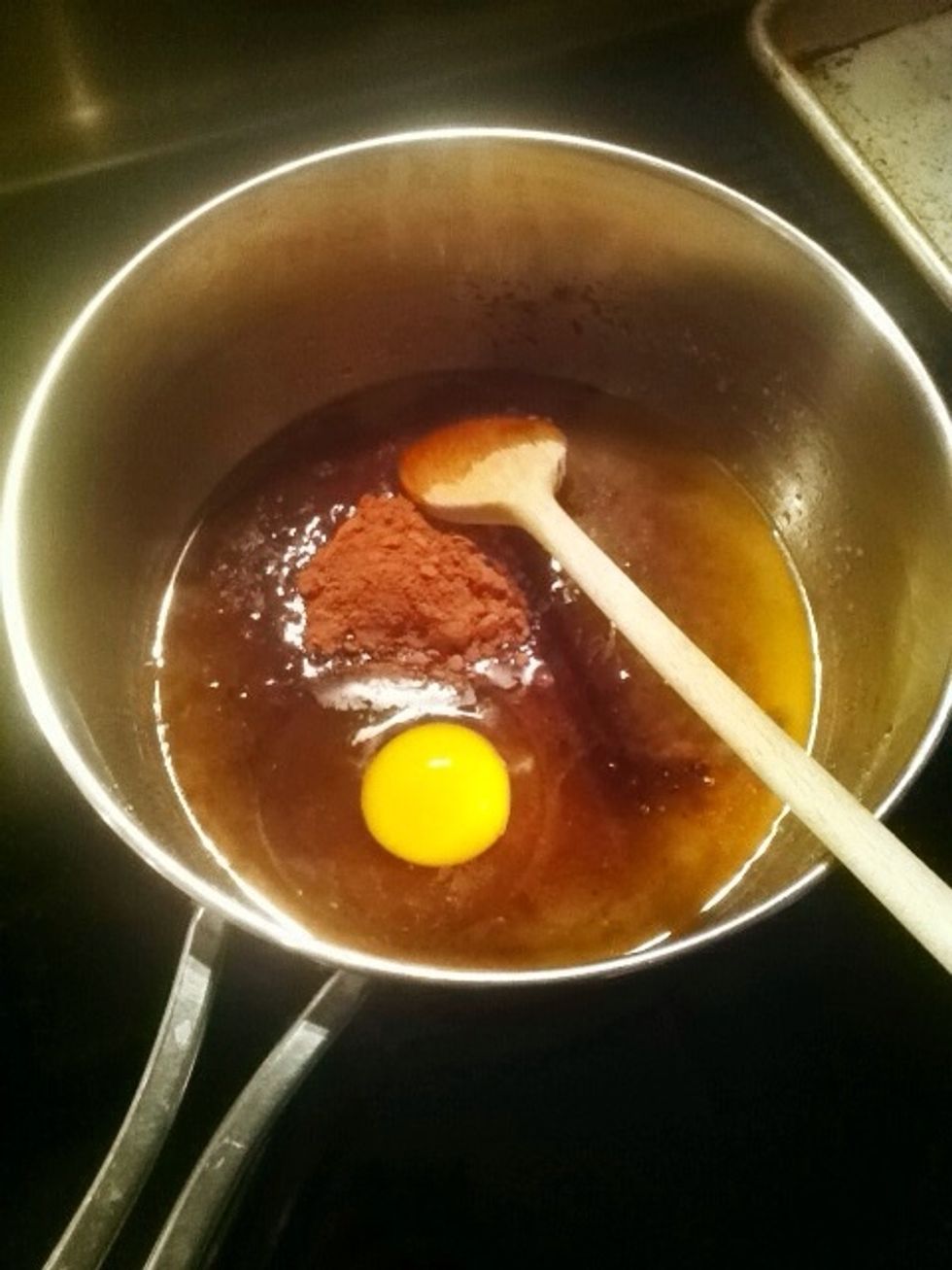 Melt the Becel Buttery Taste Margarine in a pan. Remove from heat, mix in brown sugar, egg, vanilla, flour, and the first 2 tbsp of cocoa.