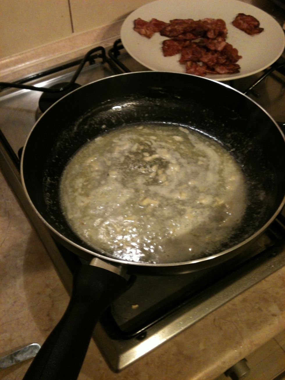 Melt the butter. Add chopped garlic. Cook it on strove until garlic is very pungent, then strain off garlic. It will give us beautiful flavor.