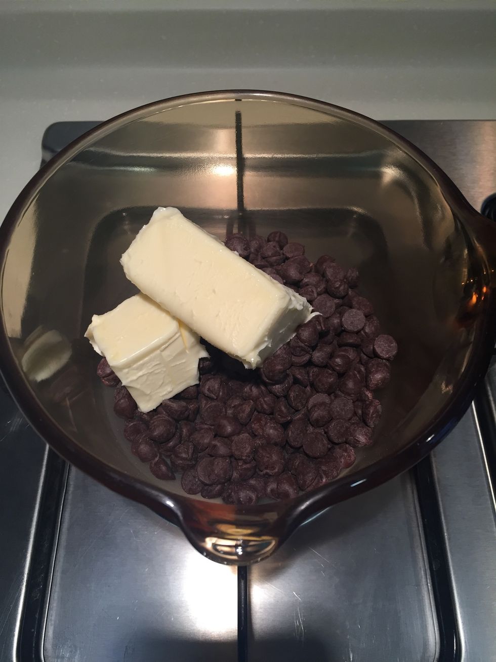 Melt the butter and the chocolate in a saucepan over low heat, stirring occasionally until smooth.