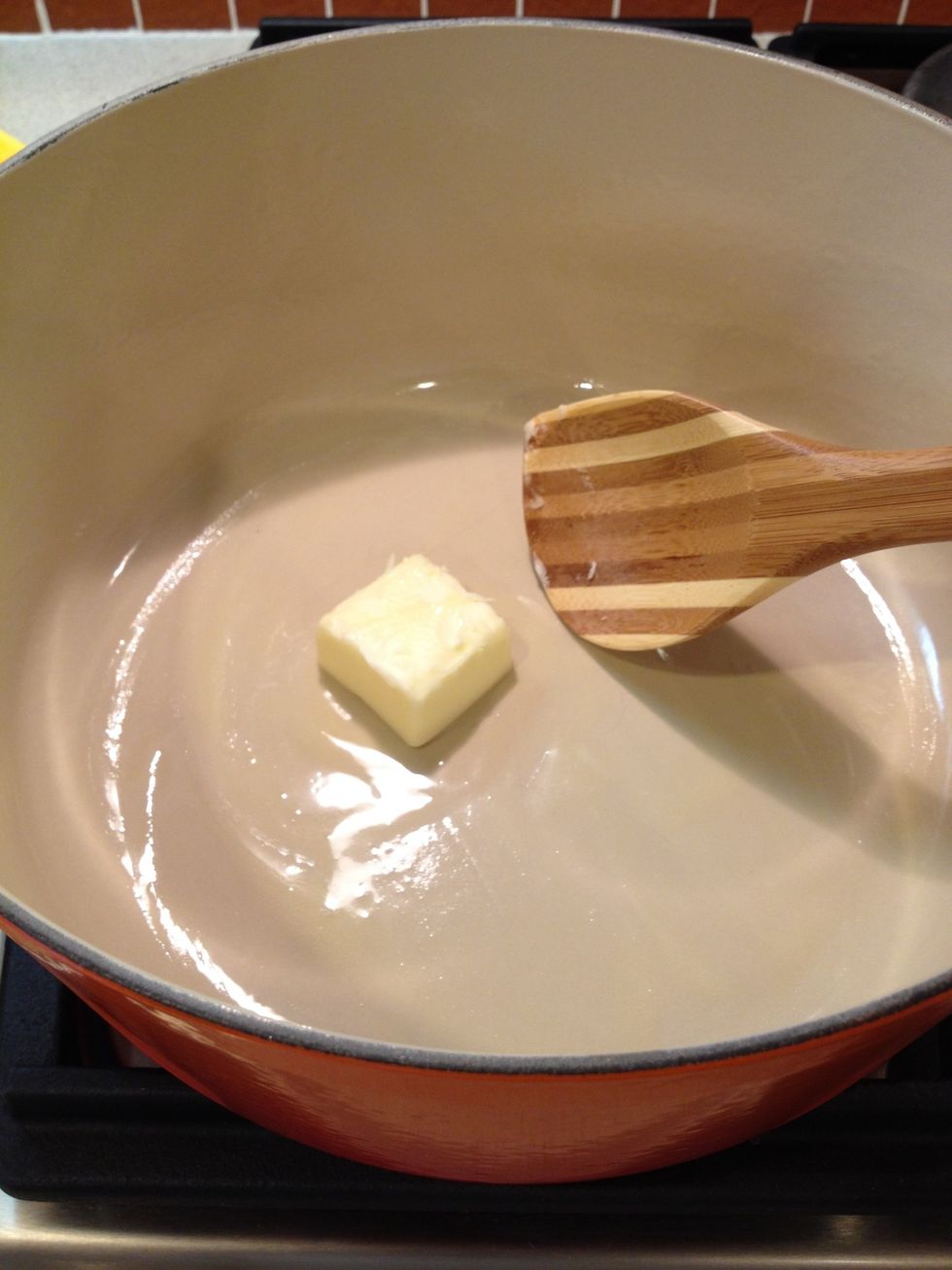 Melt the butter in a Dutch oven over medium high heat.