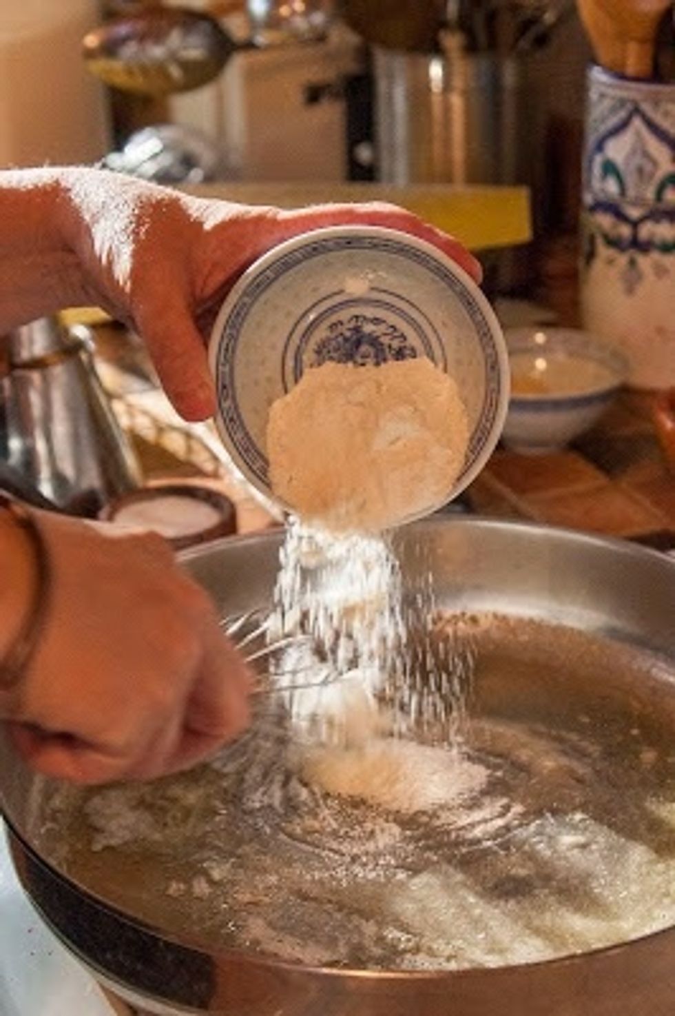 Melt the butter in a large skillet. When it's melted whisk in the flour. Whisk, whisk, whisk.