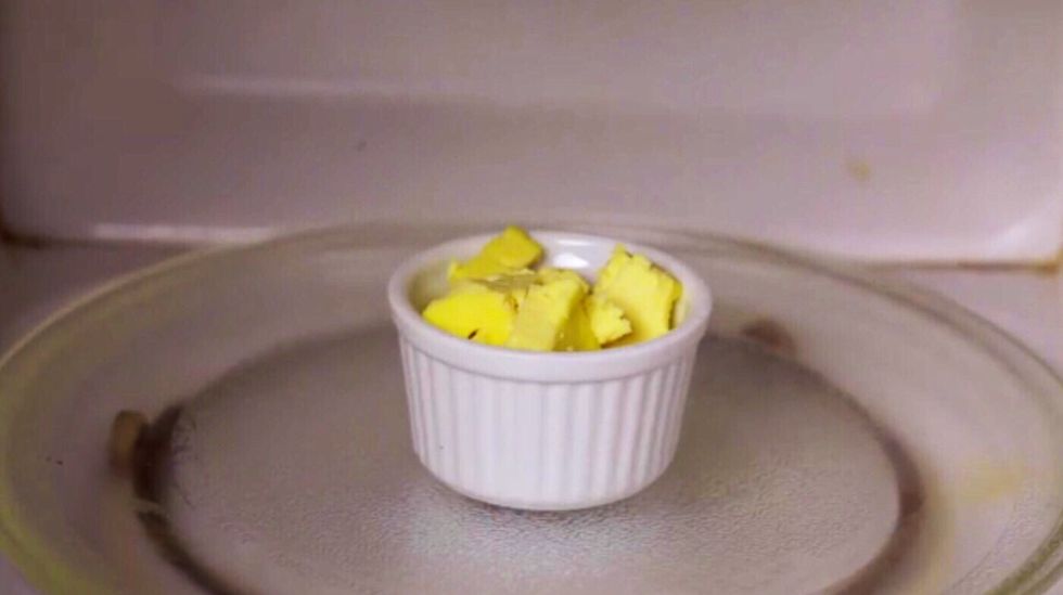 Melt the butter in a microwave-safe bowl or cup. Make sure it is completely melted. About a minute is sufficient.