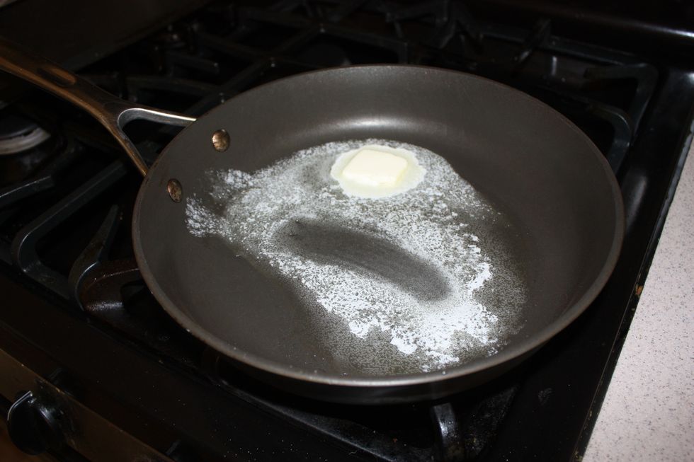 Melt the butter in a skillet. Have the skillet on medium high, depending on your stove. You want it hot enough to cook the pancakes, but you don't want to burn the butter.