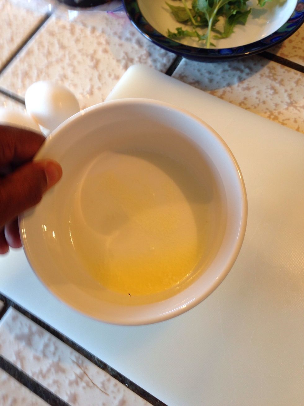 Melt the butter in the bowl and coat the bottom and sides.