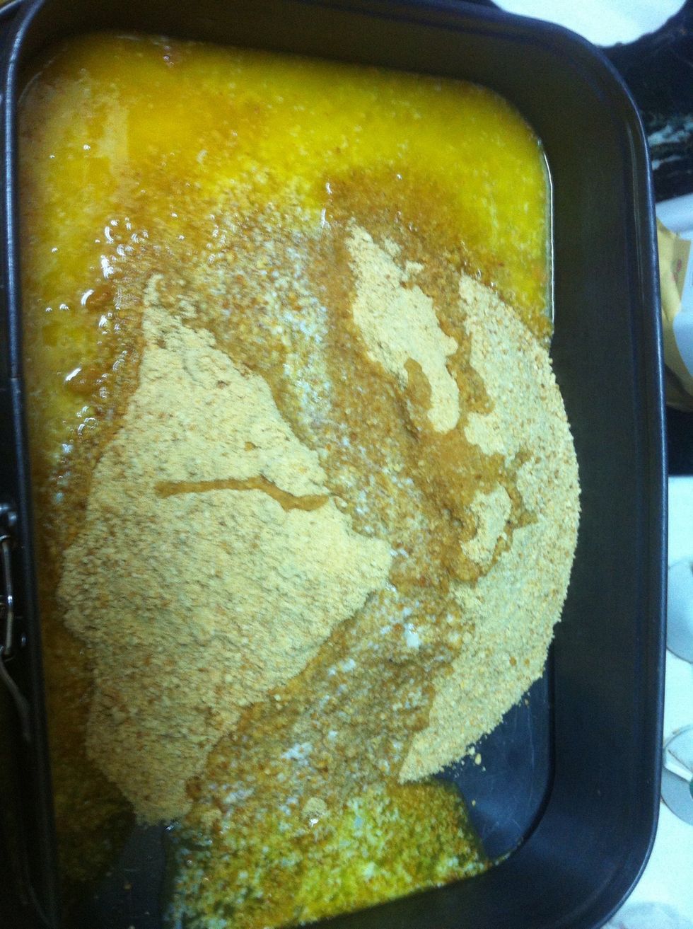 melt the butter in the microwave and crunch the biscuits add them both to the tray