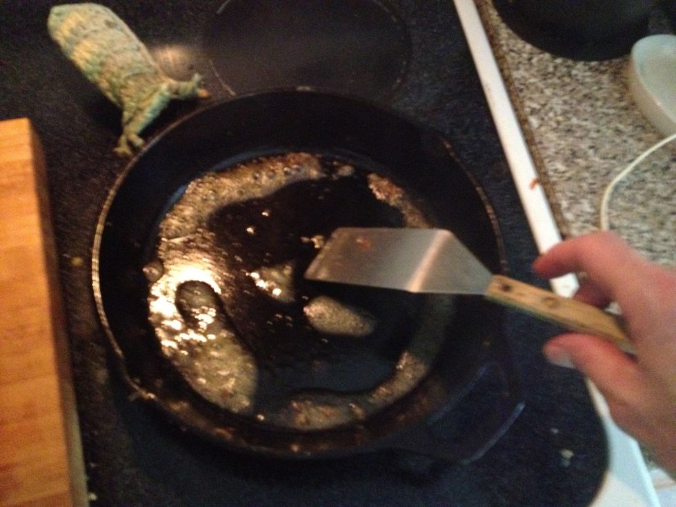 Melt the butter. Spread it around a bit to coat the pan.