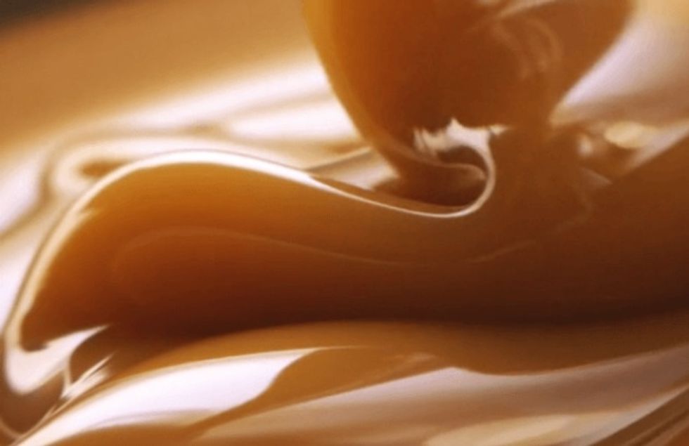 Melt the caramel then add the applesauce and mix