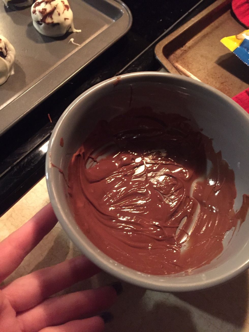 Melt the chocolate and cover half of them with milk and the other half in white
