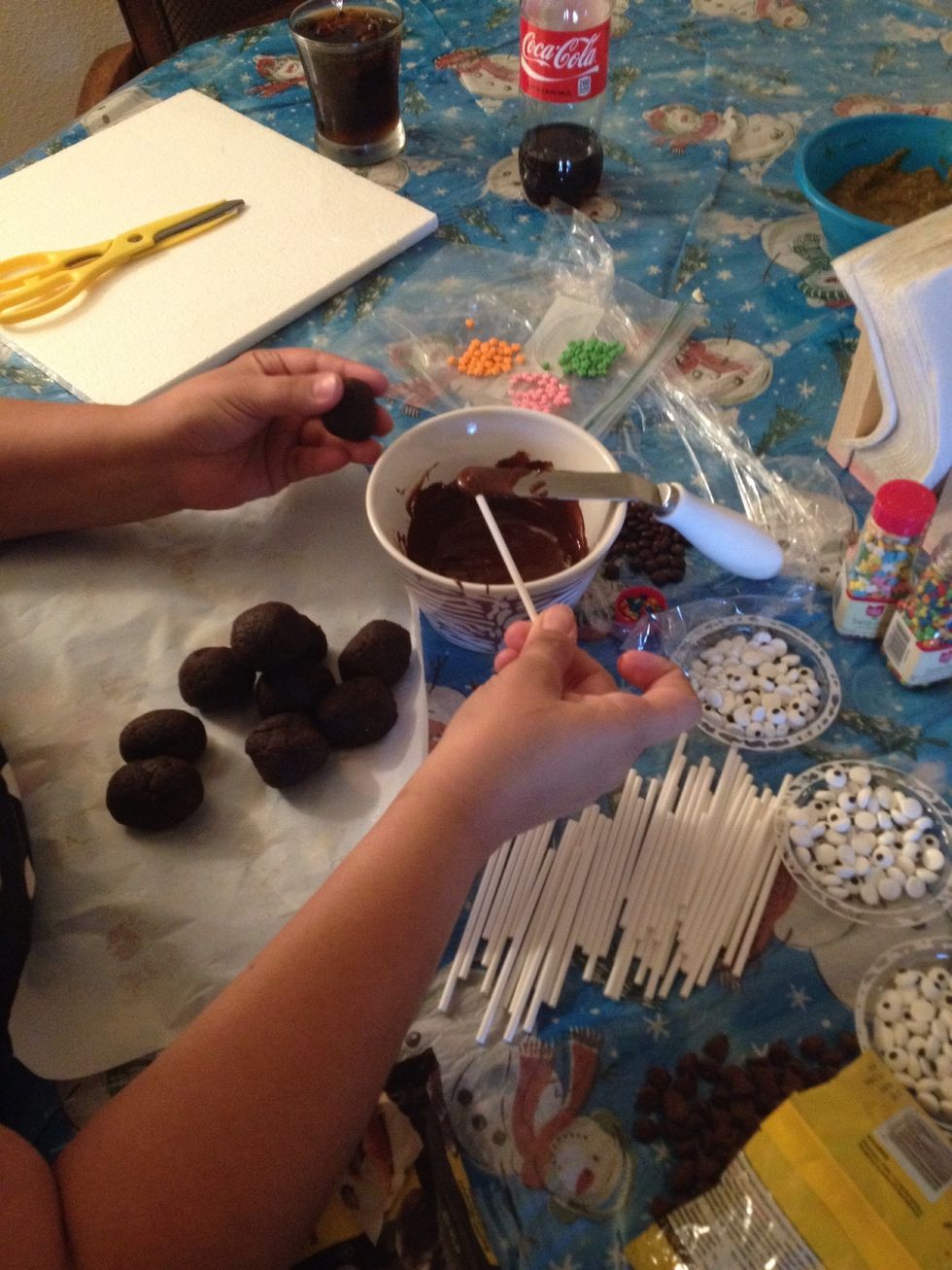 Melt the chocolate candy coating in a microwave safe plastic bowl, following the instructions on the package. The coating should be about 3 inches deep for easier dipping.