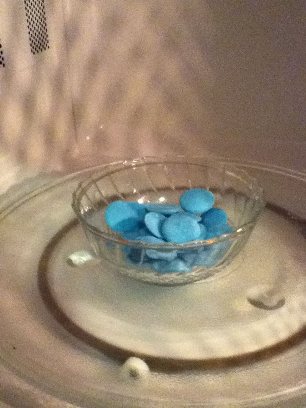 Melt the chocolate: I used blue wilton candy melts, in the microwave at 50% power, stirring the chocolate every 30 seconds until melted