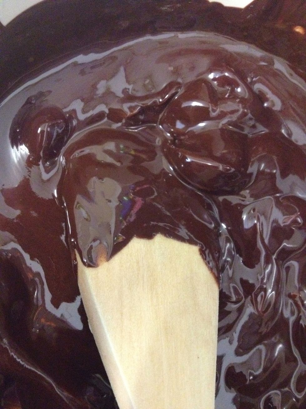 Melt the chocolate in a Bain Marie or microwave- just be careful of burning it! Or scalding yourself (experience of both at once!)