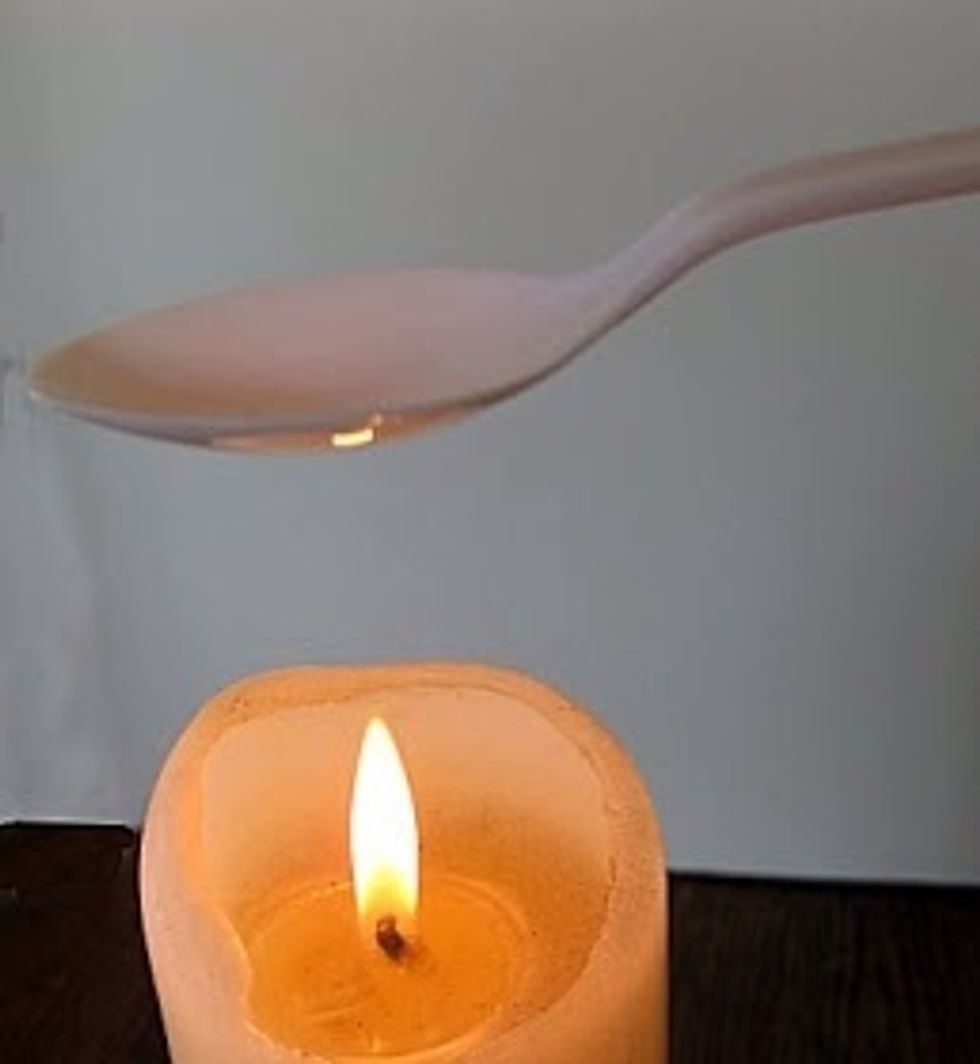 Melt the rest of the spoons but this time heat the underside of the bowls. After it melts Take the spoon off the heat and carefully pull on the tip and bend it backwards. Hold until cool and set.